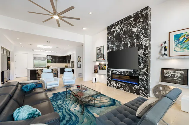 a view of a patio with table and chairs potted plants
