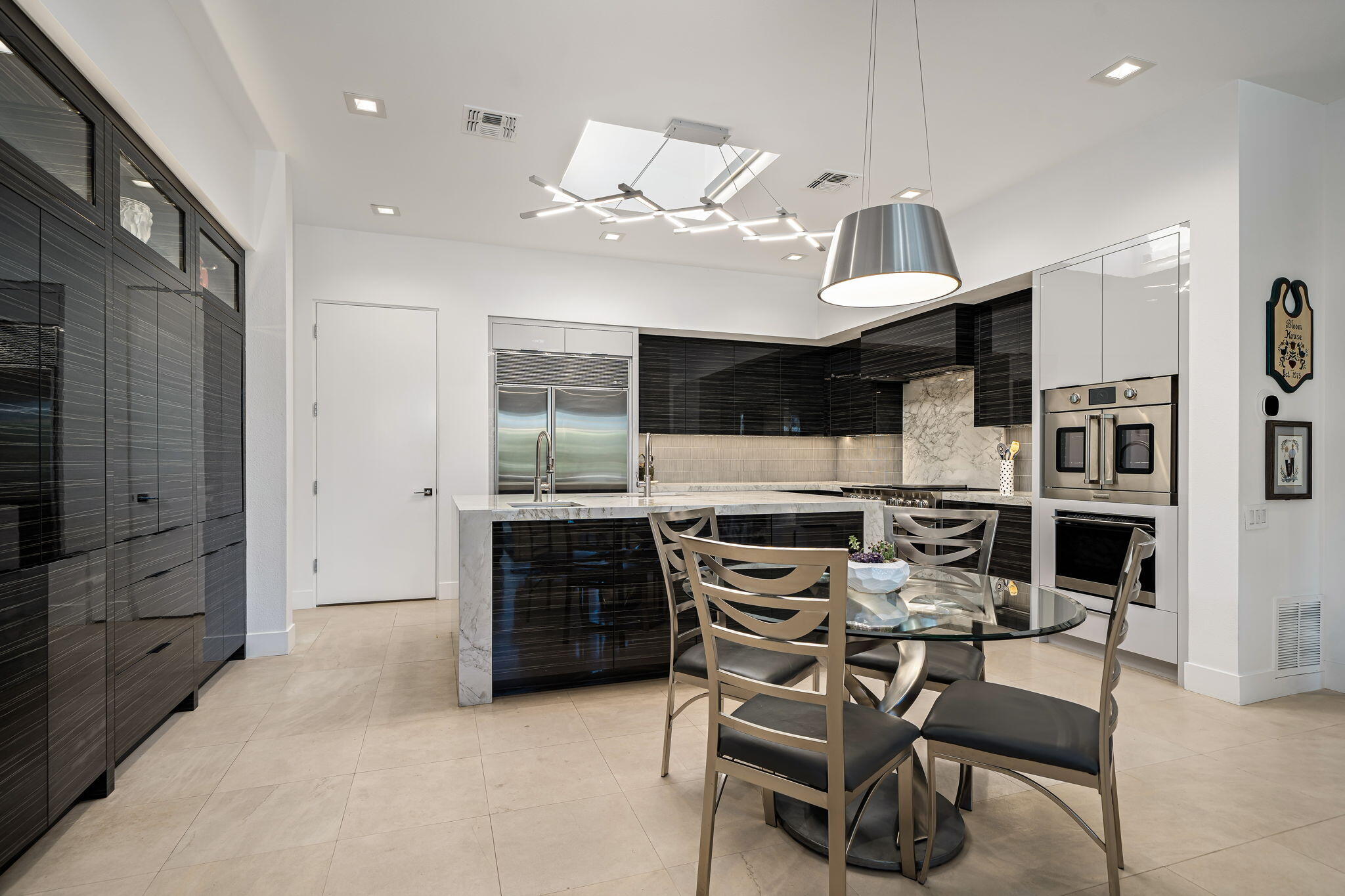 105 Waterford Circle Rancho Mirage, CA 92270 - Photo 37 of 76 a kitchen with stainless steel appliances kitchen island granite countertop a stove and a refrigerator