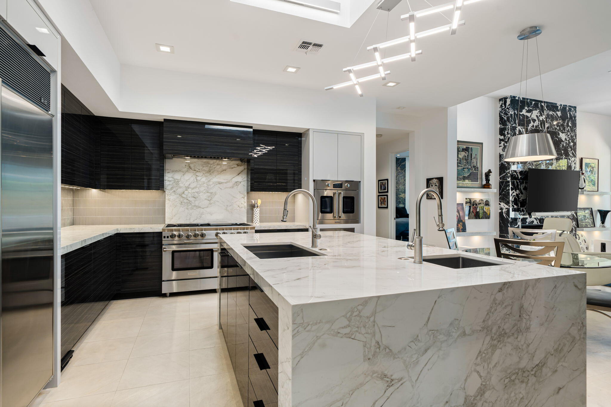 105 Waterford Circle Rancho Mirage, CA 92270 - Photo 41 of 76 a kitchen with stainless steel appliances kitchen island granite countertop a stove and a sink