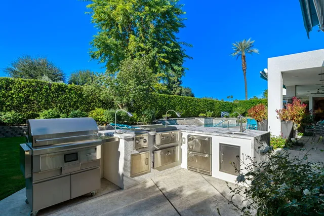 a bathroom with a granite countertop sink a mirror and a vanity
