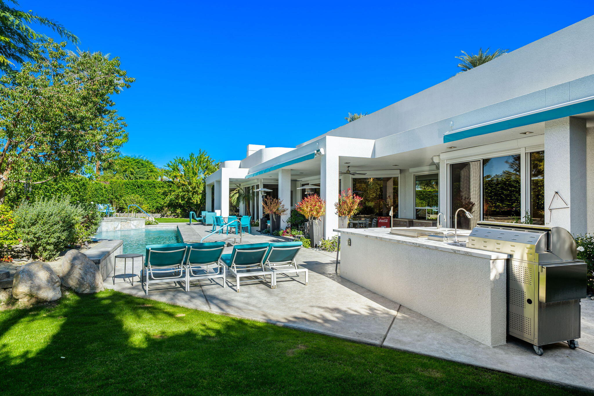 105 Waterford Circle Rancho Mirage, CA 92270 - Photo 46 of 76 a view of a house with backyard porch and sitting area