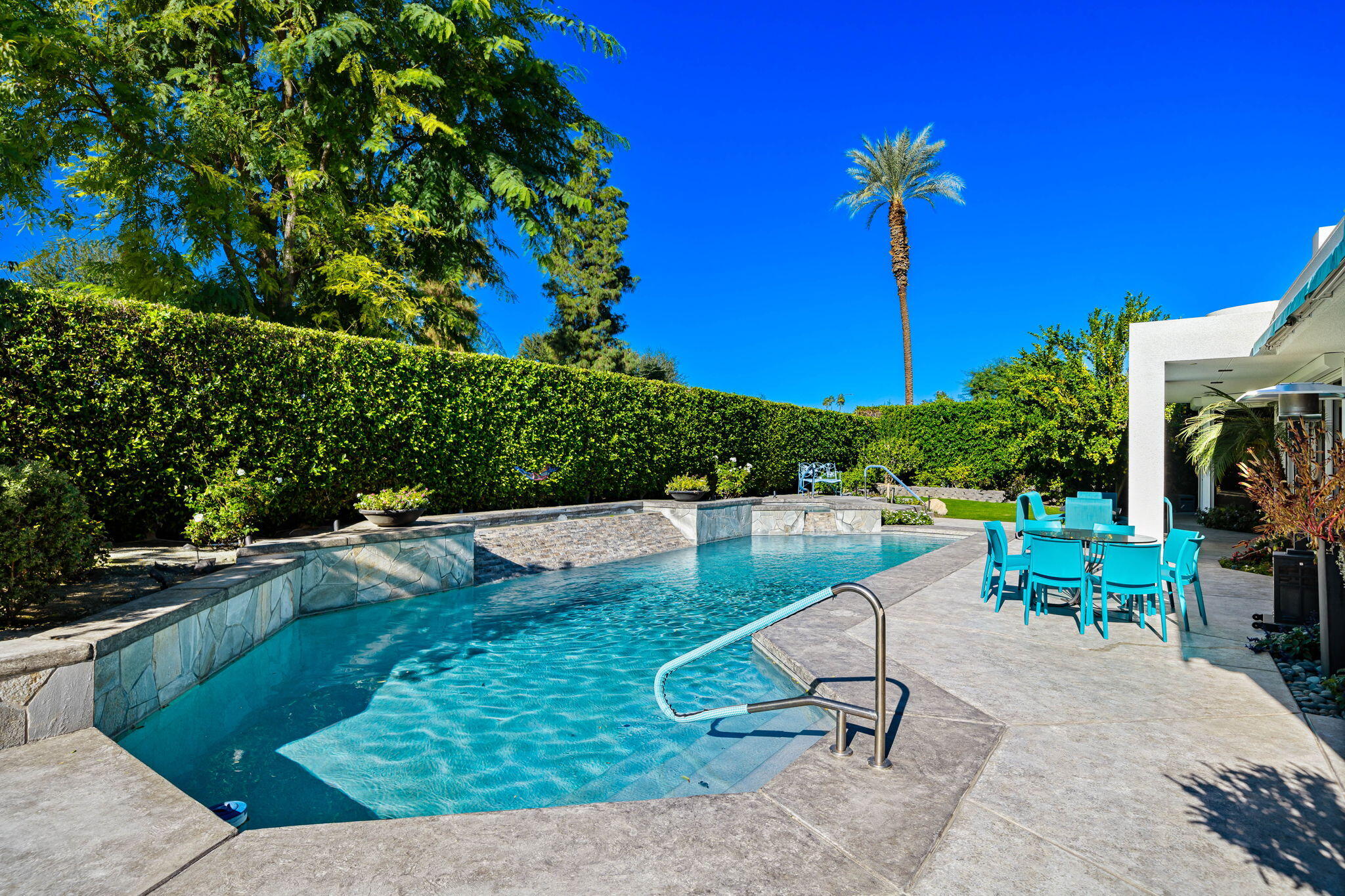 105 Waterford Circle Rancho Mirage, CA 92270 - Photo 48 of 76 a view of a swimming pool with a patio