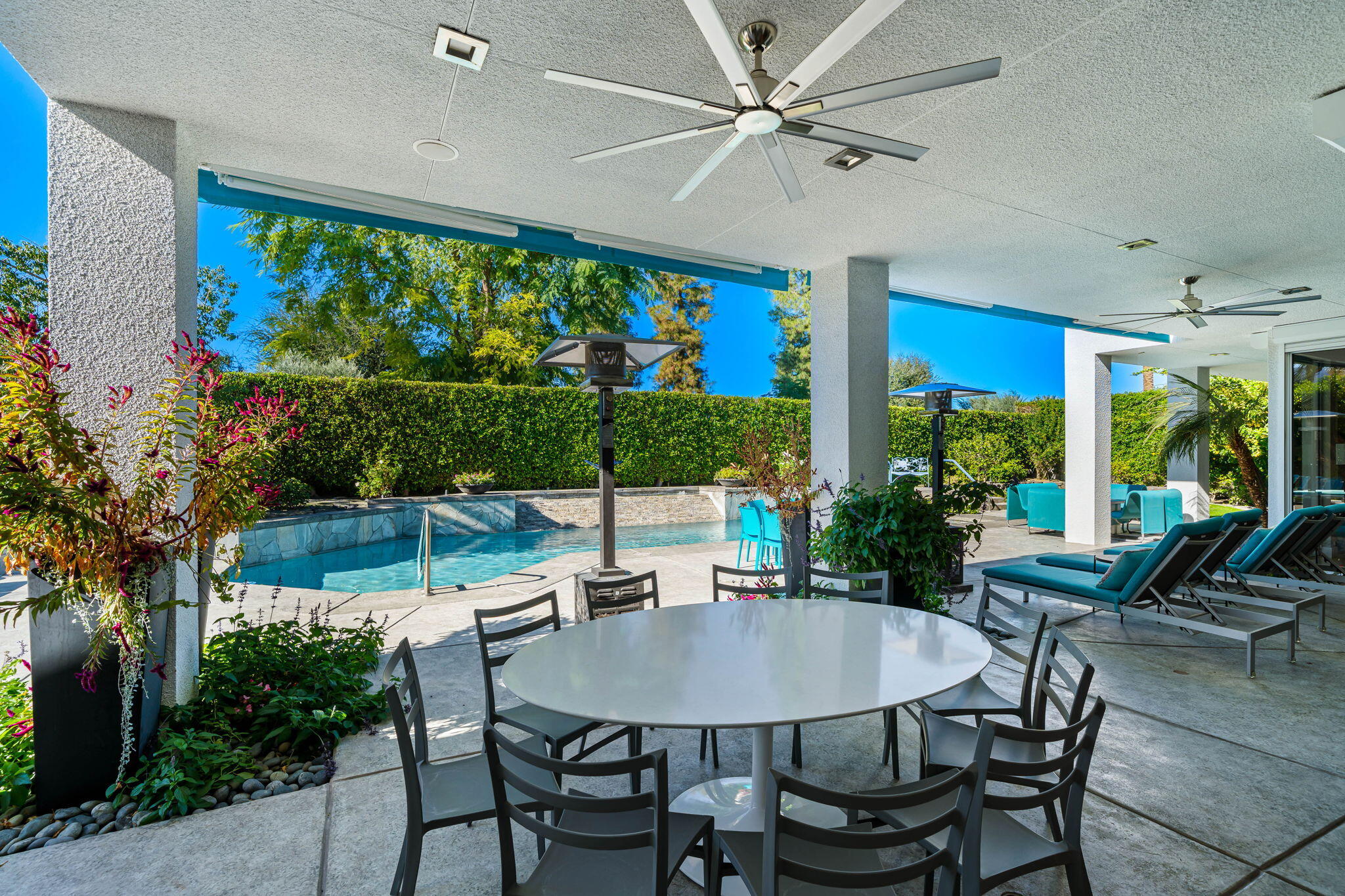 105 Waterford Circle Rancho Mirage, CA 92270 - Photo 50 of 76 a view of a dining room with furniture large windows and wooden floor