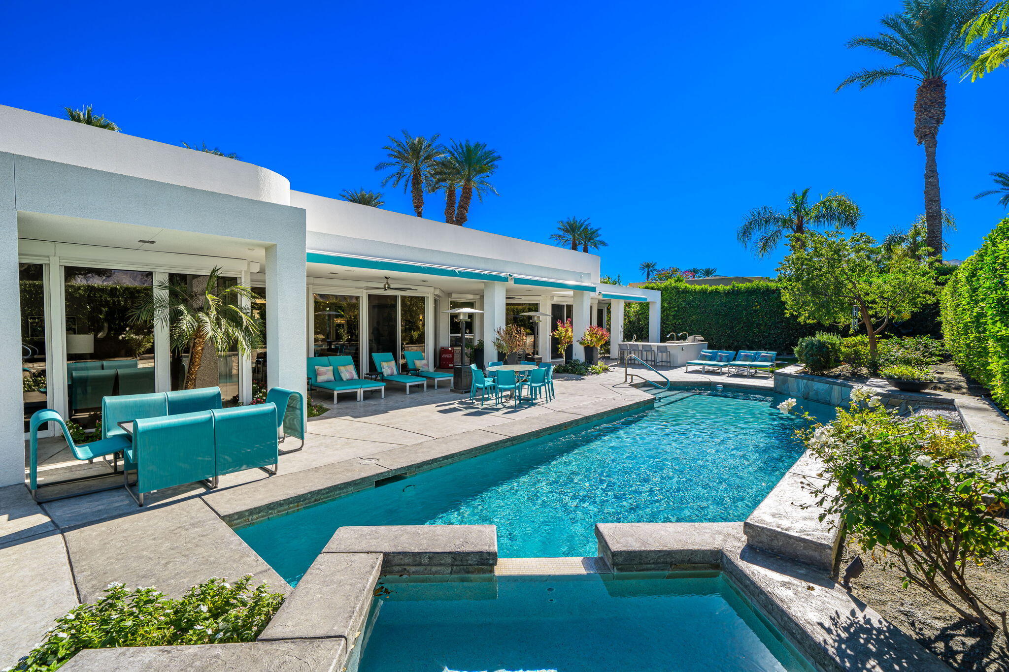 105 Waterford Circle Rancho Mirage, CA 92270 - Photo 55 of 76 a view of a house with backyard sitting area and garden