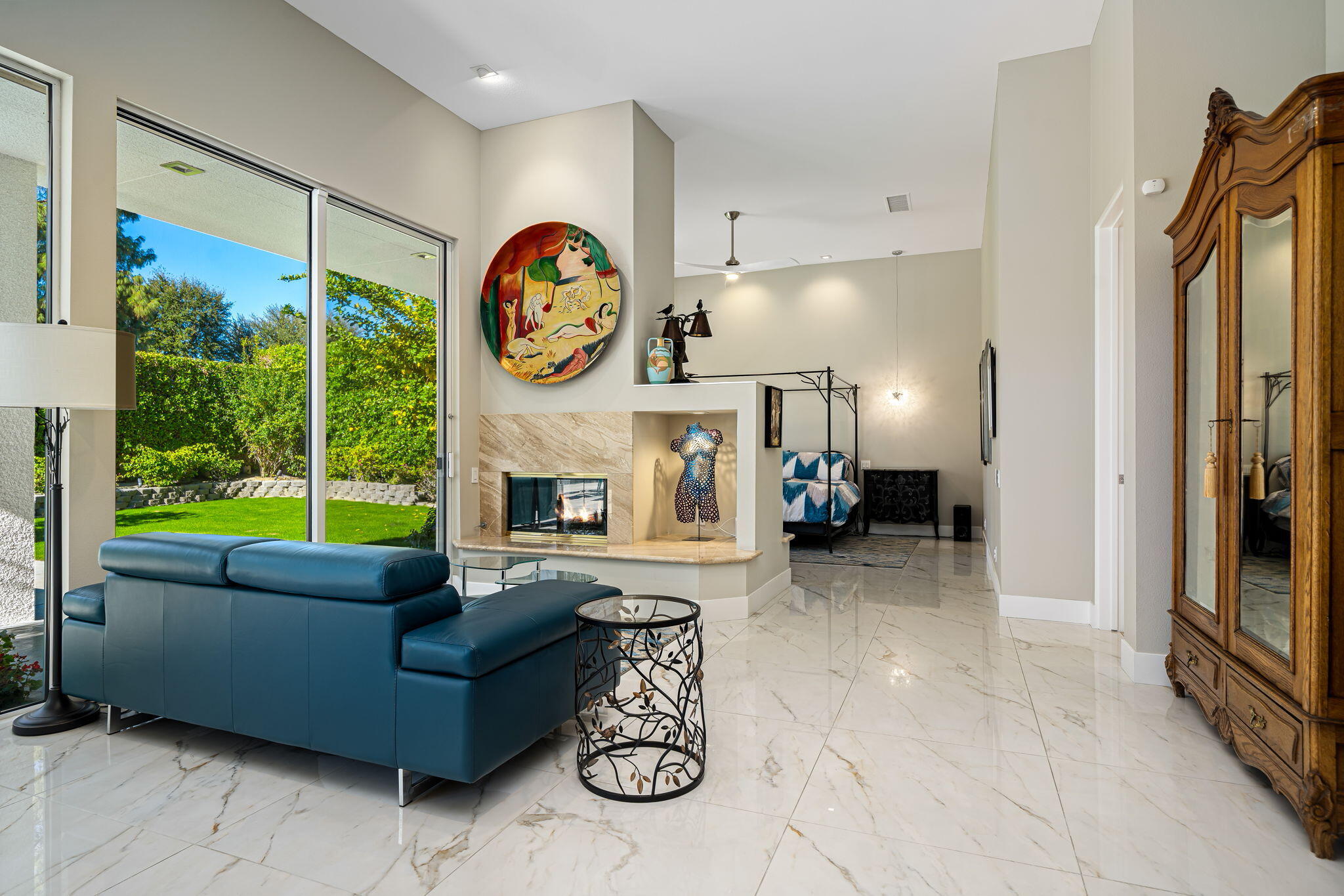 105 Waterford Circle Rancho Mirage, CA 92270 - Photo 60 of 76 a living room with furniture a fireplace and a large window