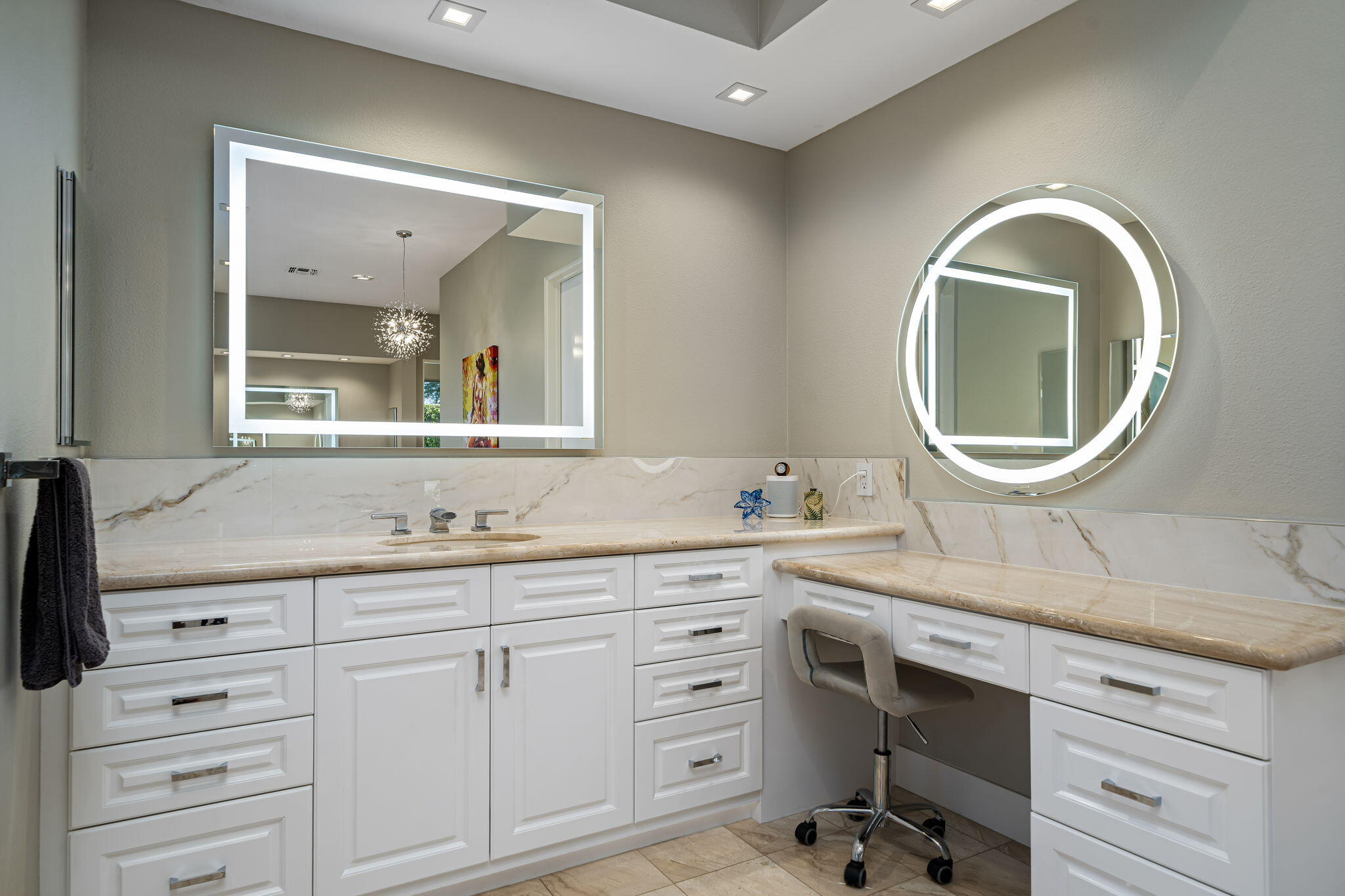 105 Waterford Circle Rancho Mirage, CA 92270 - Photo 65 of 76 a bathroom with a granite countertop sink a mirror and a vanity