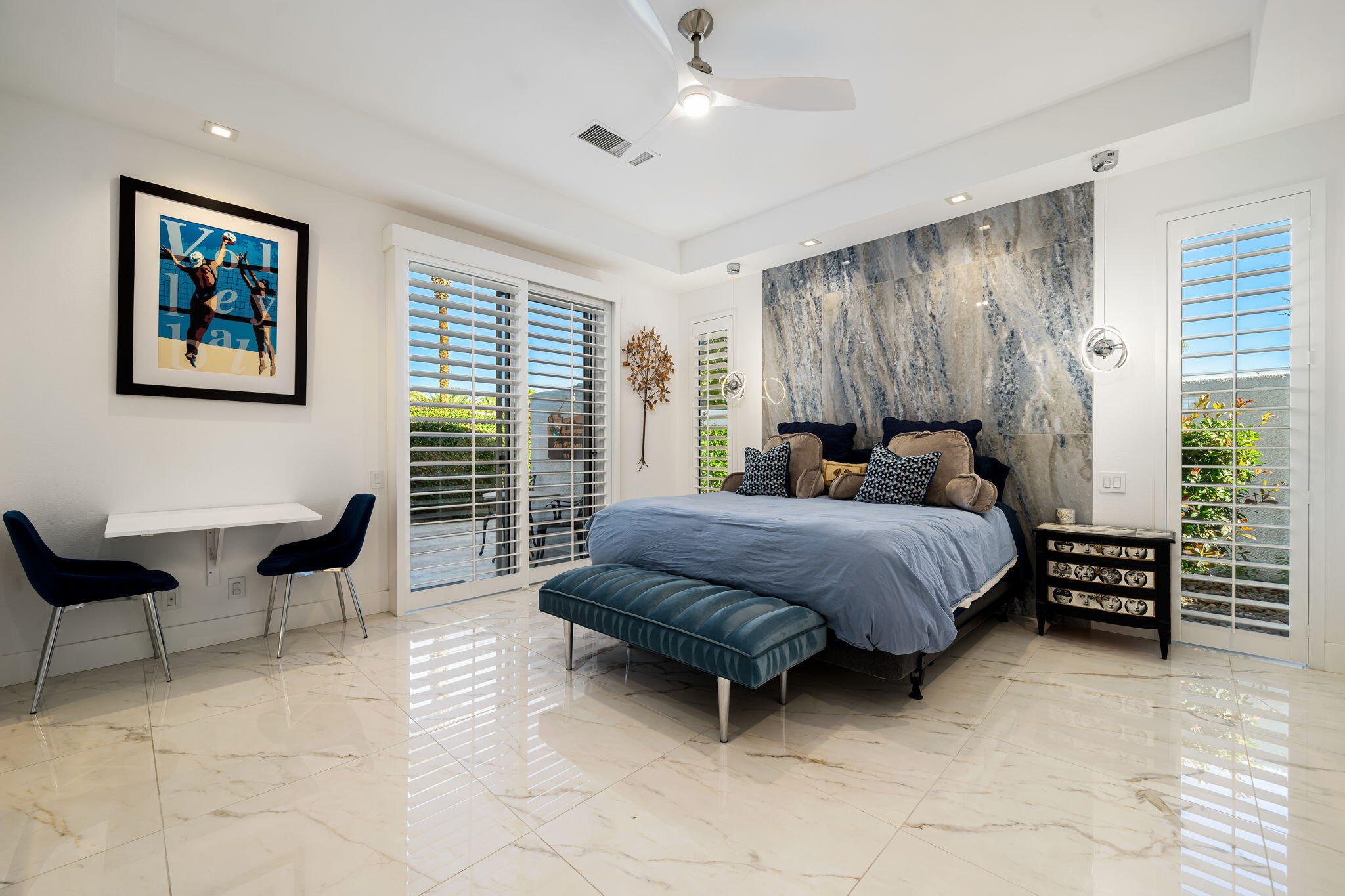 105 Waterford Circle Rancho Mirage, CA 92270 - Photo 72 of 76 a bedroom with a bed and a couch