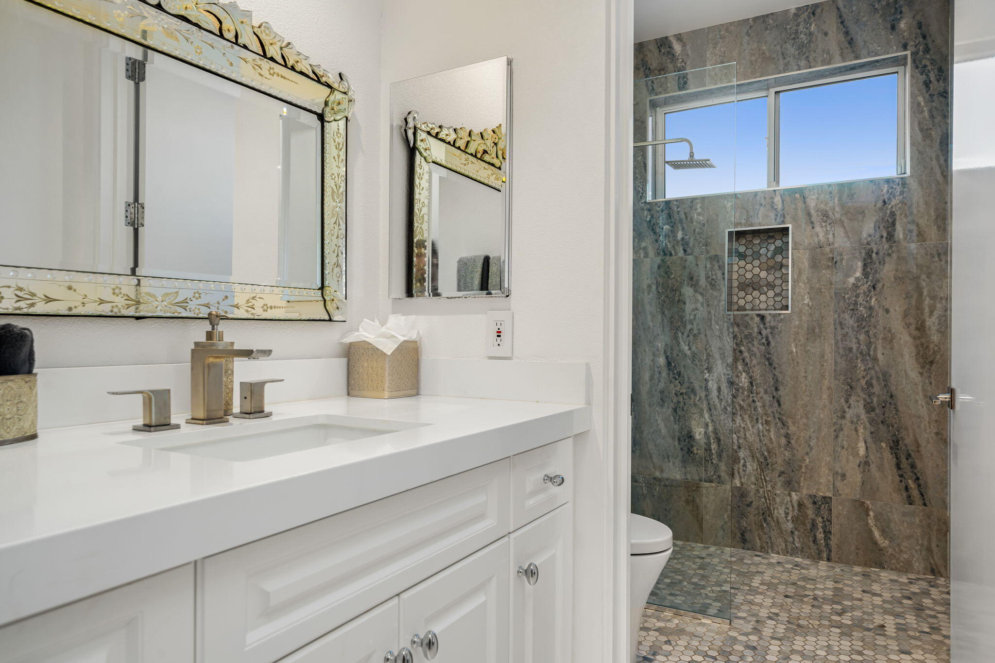 105 Waterford Circle Rancho Mirage, CA 92270 - Photo 73 of 76 a bathroom with a sink a toilet and shower