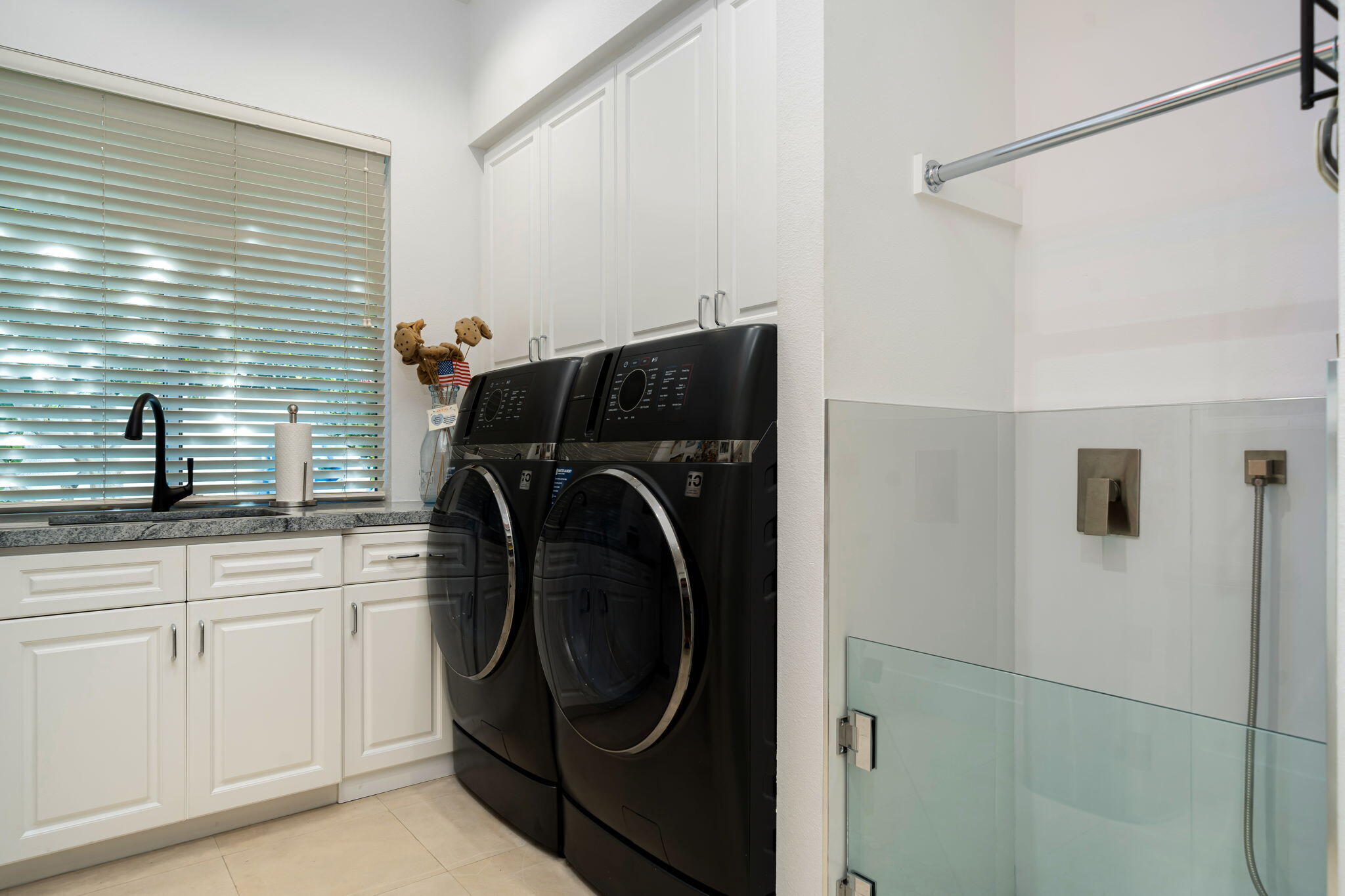 105 Waterford Circle Rancho Mirage, CA 92270 - Photo 76 of 76 a utility room with sink dryer and washer