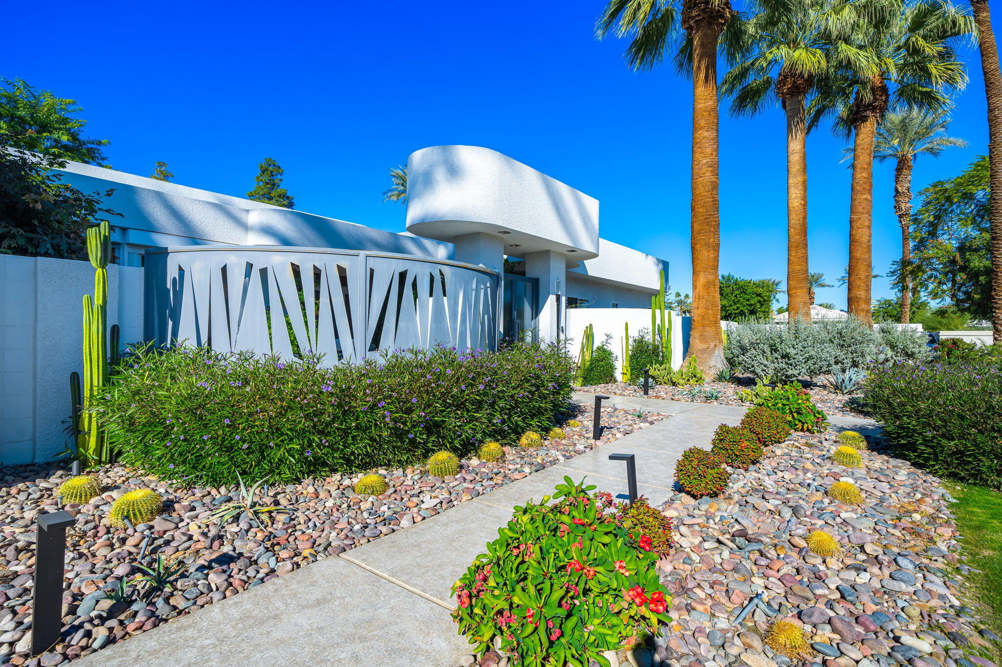 105 Waterford Circle Rancho Mirage, CA 92270 - Photo 9 of 76 a view of a house with a flower garden