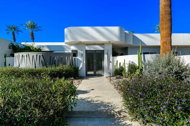 a front view of a house with a porch