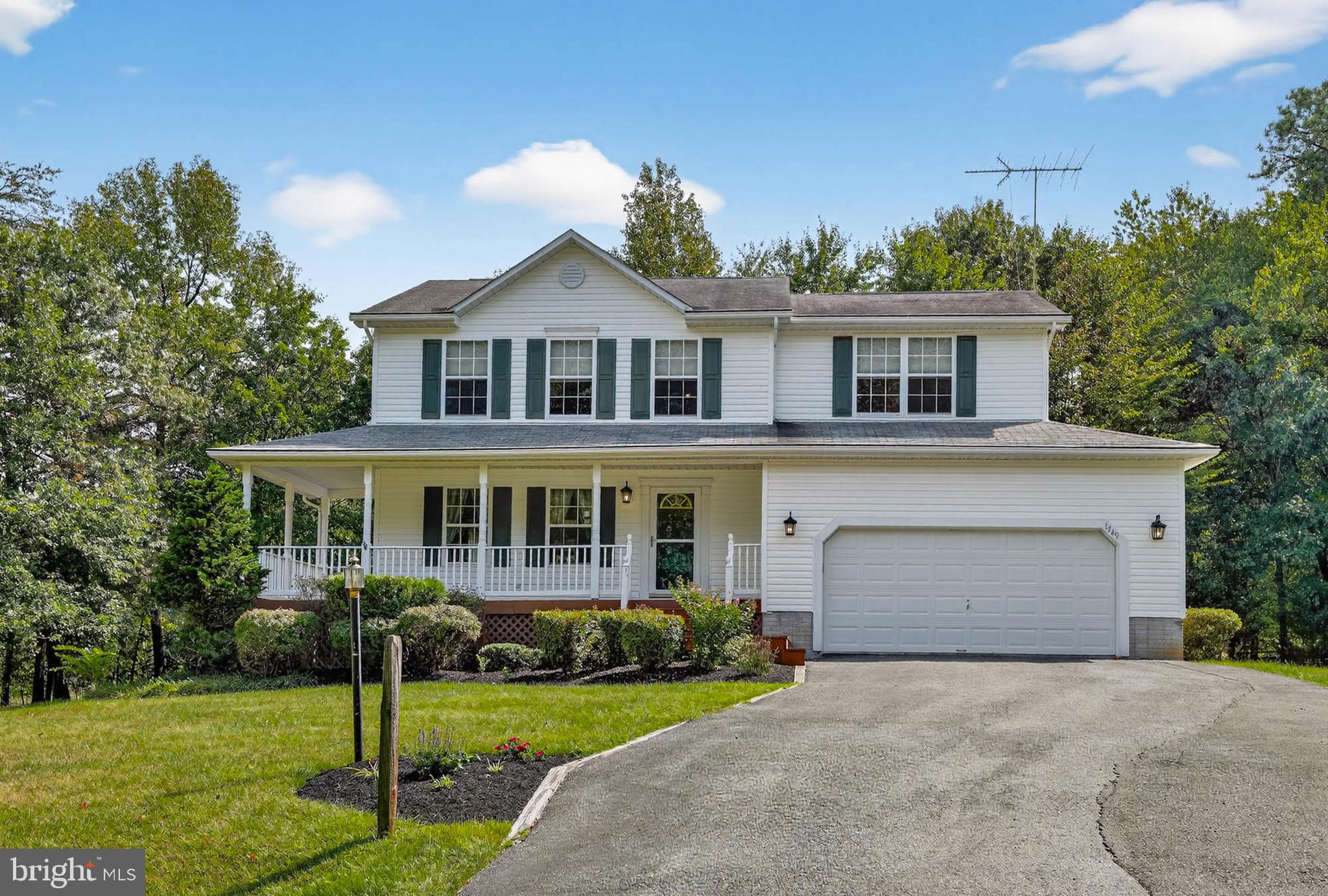 1749 Maple Avenue Hanover, MD 21076 - Photo 2 of 41 a front view of a house with a yard and garage