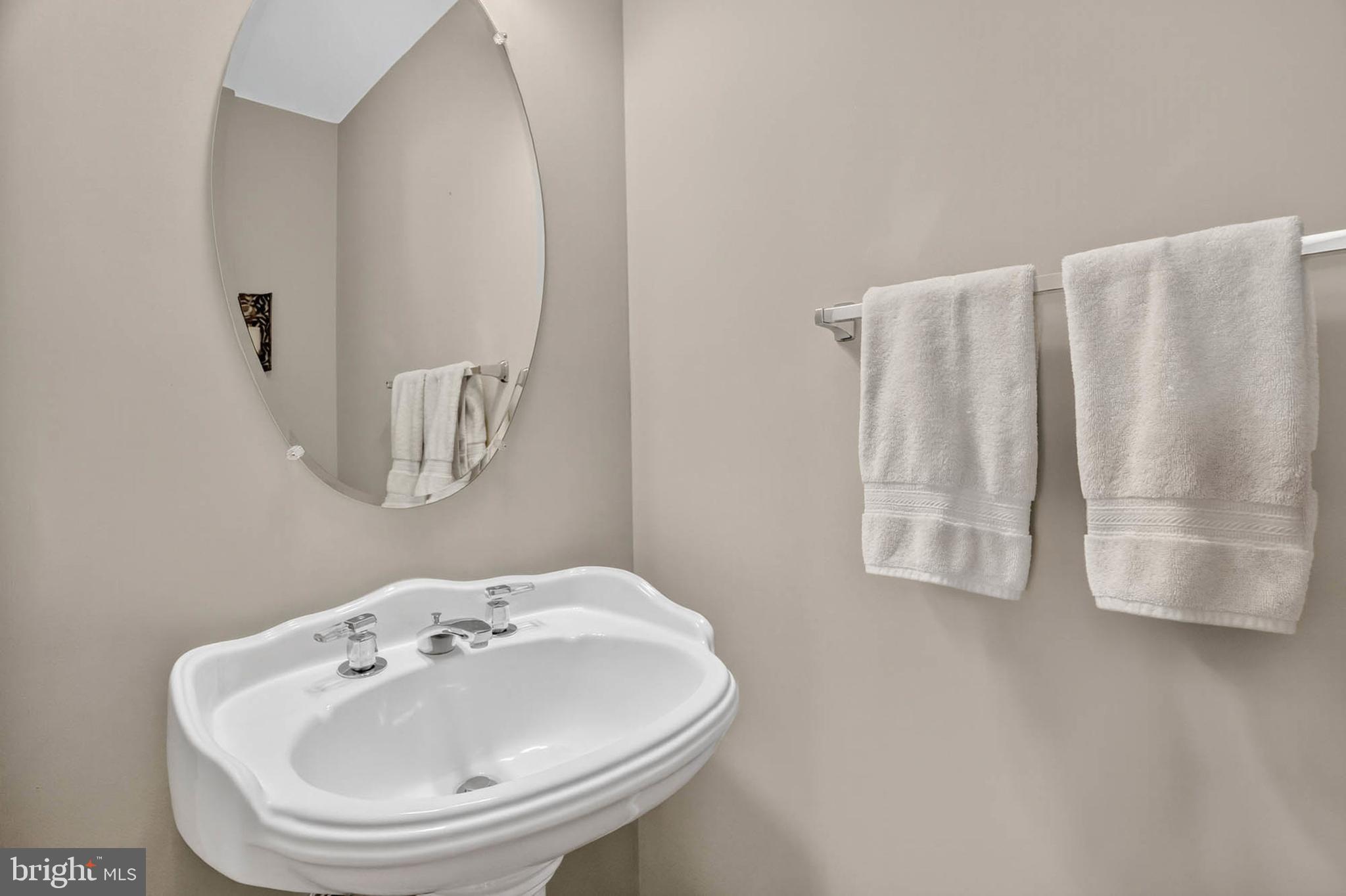 1749 Maple Avenue Hanover, MD 21076 - Photo 21 of 41 a bathroom with a sink and a mirror