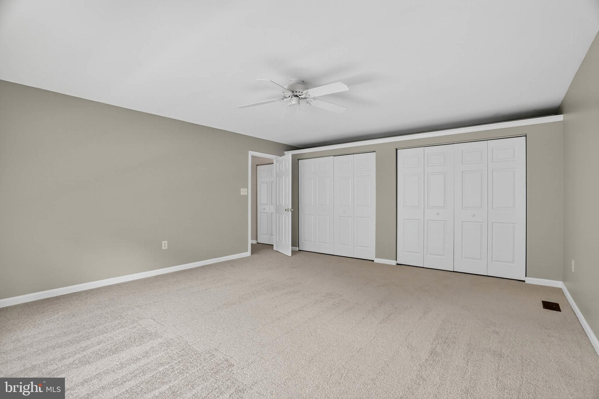 1749 Maple Avenue Hanover, MD 21076 - Photo 28 of 41 a view of an empty room with a ceiling fan