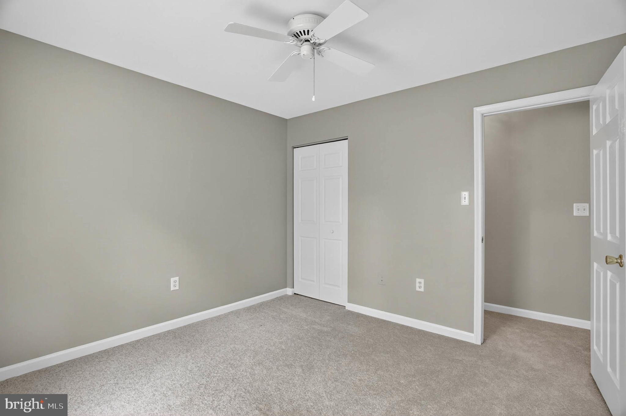 1749 Maple Avenue Hanover, MD 21076 - Photo 30 of 41 an empty room with a chandelier fan and windows