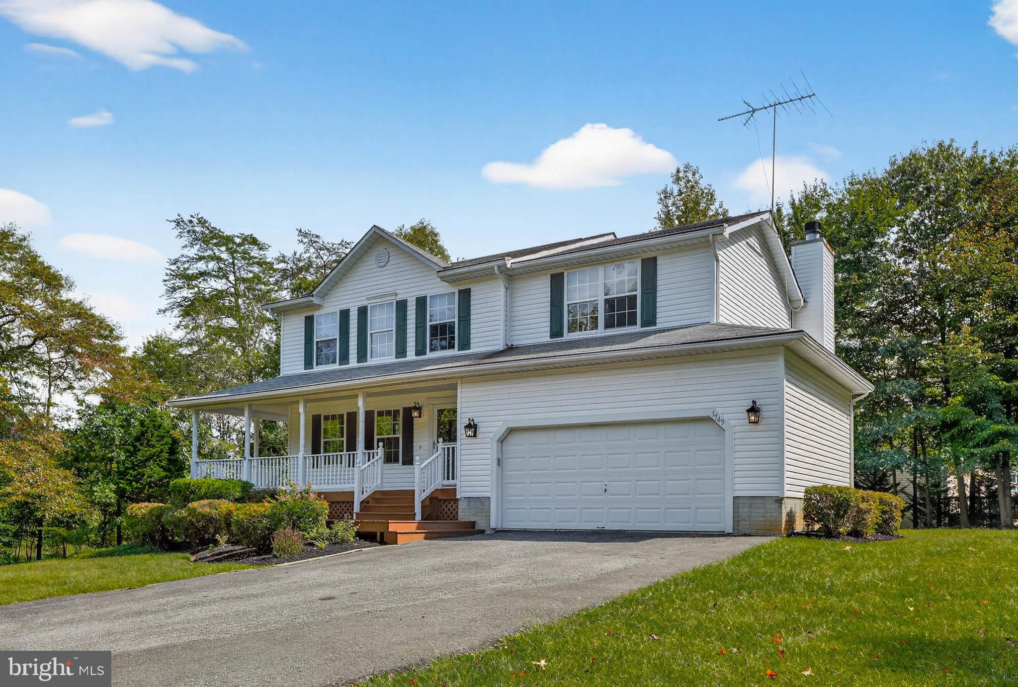 1749 Maple Avenue Hanover, MD 21076 - Photo 3 of 41 a front view of a house with a yard and garage
