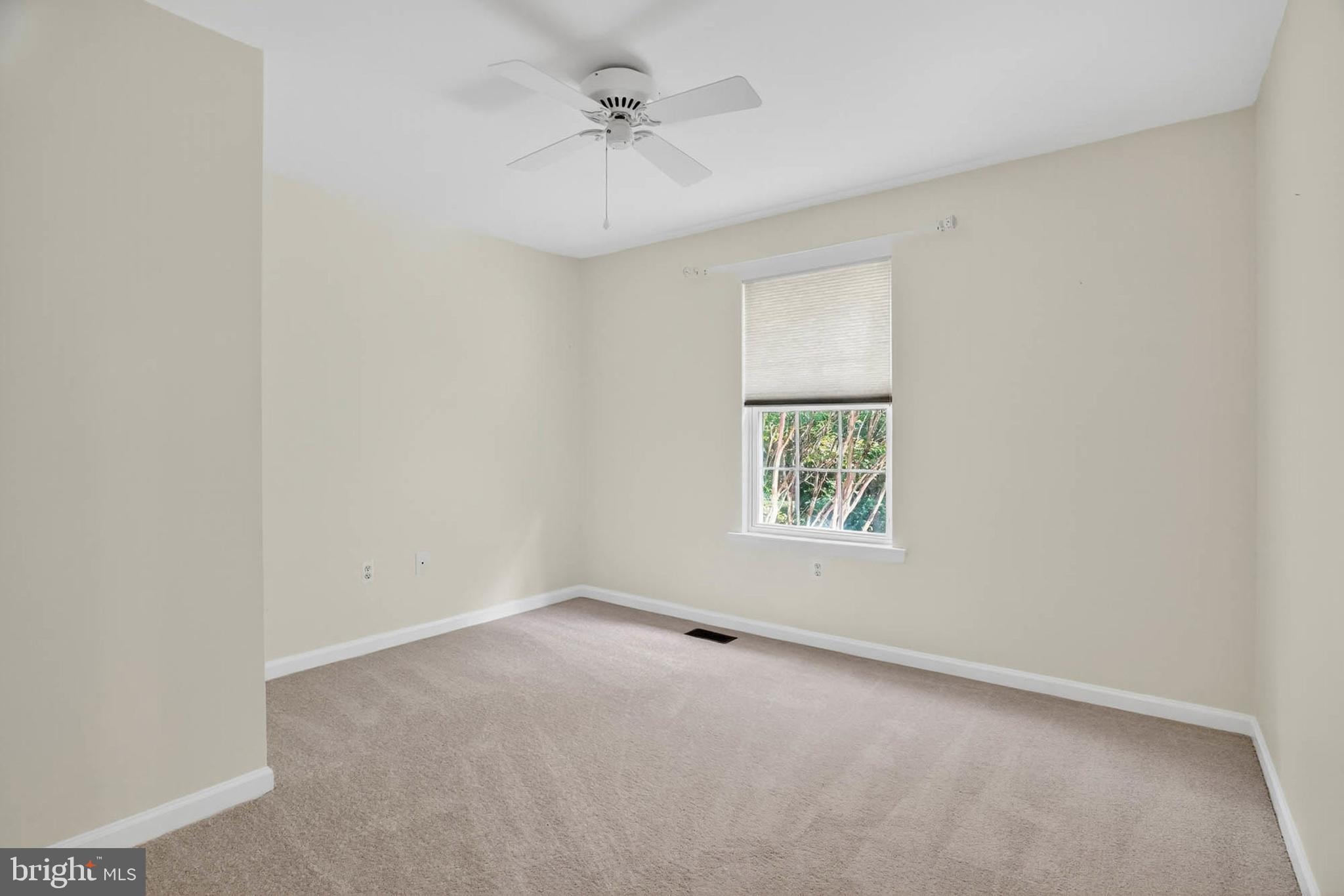 1749 Maple Avenue Hanover, MD 21076 - Photo 31 of 41 an empty room with a window and a fan