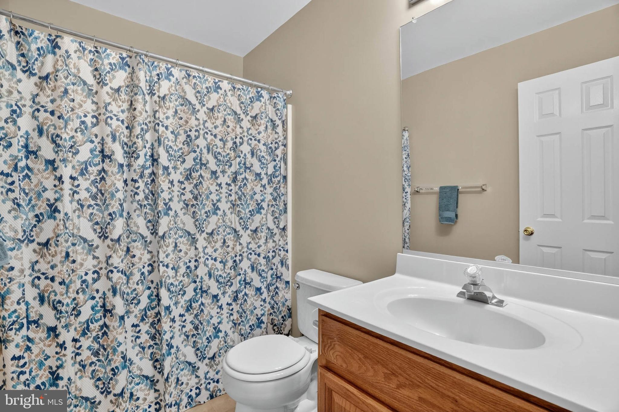 1749 Maple Avenue Hanover, MD 21076 - Photo 33 of 41 a bathroom with a sink toilet and mirror