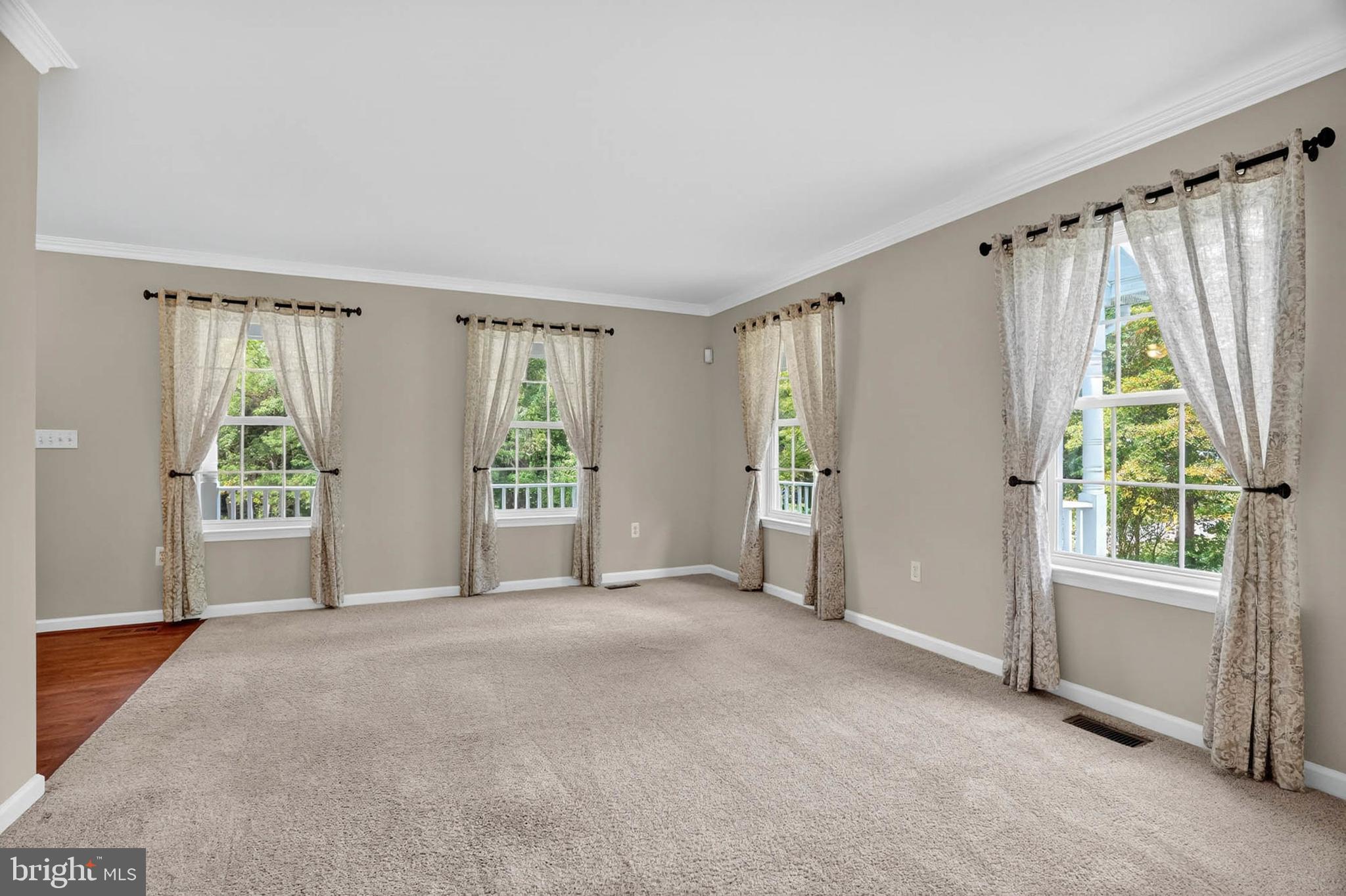 1749 Maple Avenue Hanover, MD 21076 - Photo 9 of 41 a view of a big room with windows and walls chandelier