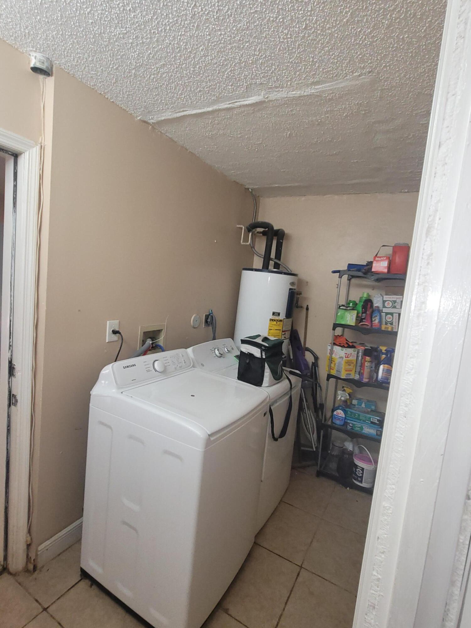 8448 Northwest 196th Terrace Hialeah, FL 33015 - Photo 12 of 67 a utility room with dryer and washer