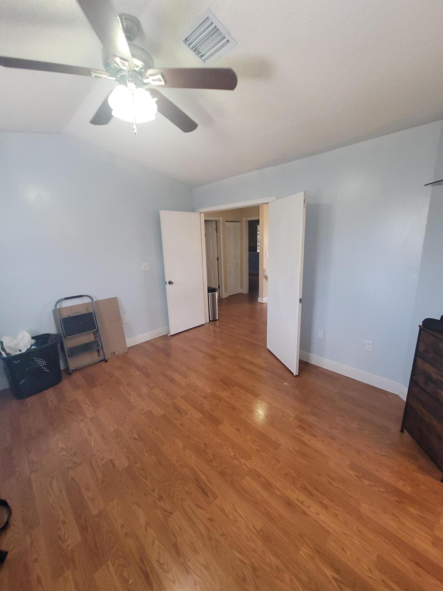 8448 Northwest 196th Terrace Hialeah, FL 33015 - Photo 14 of 67 a view of an empty room with chandelier fan