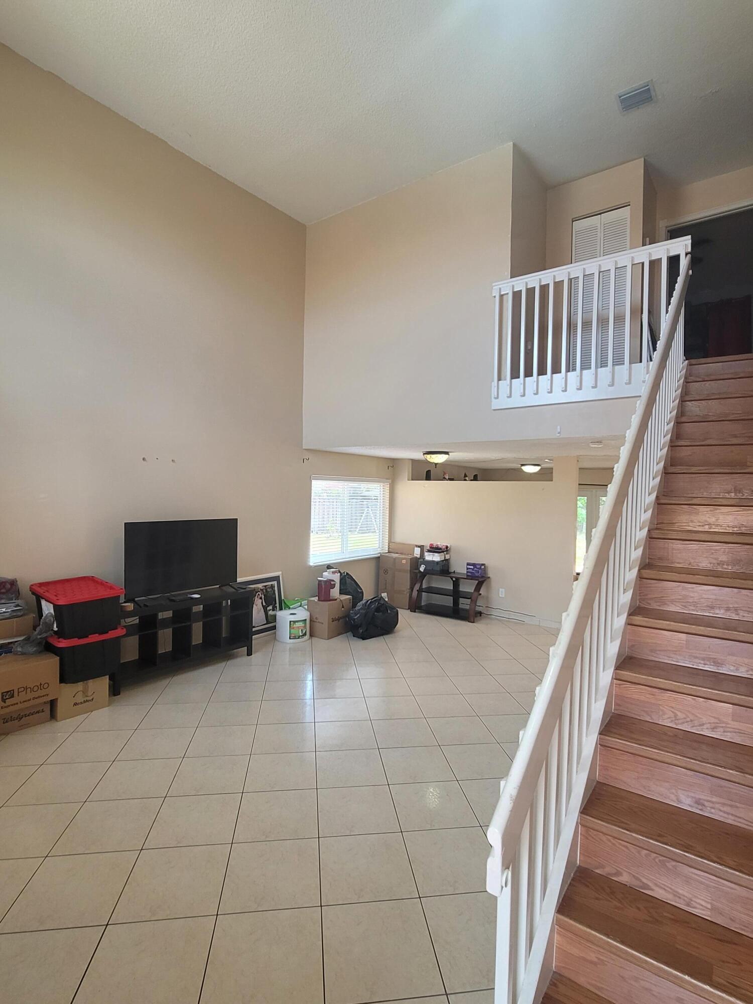 8448 Northwest 196th Terrace Hialeah, FL 33015 - Photo 2 of 67 a view of a livingroom with furniture and a flat screen tv