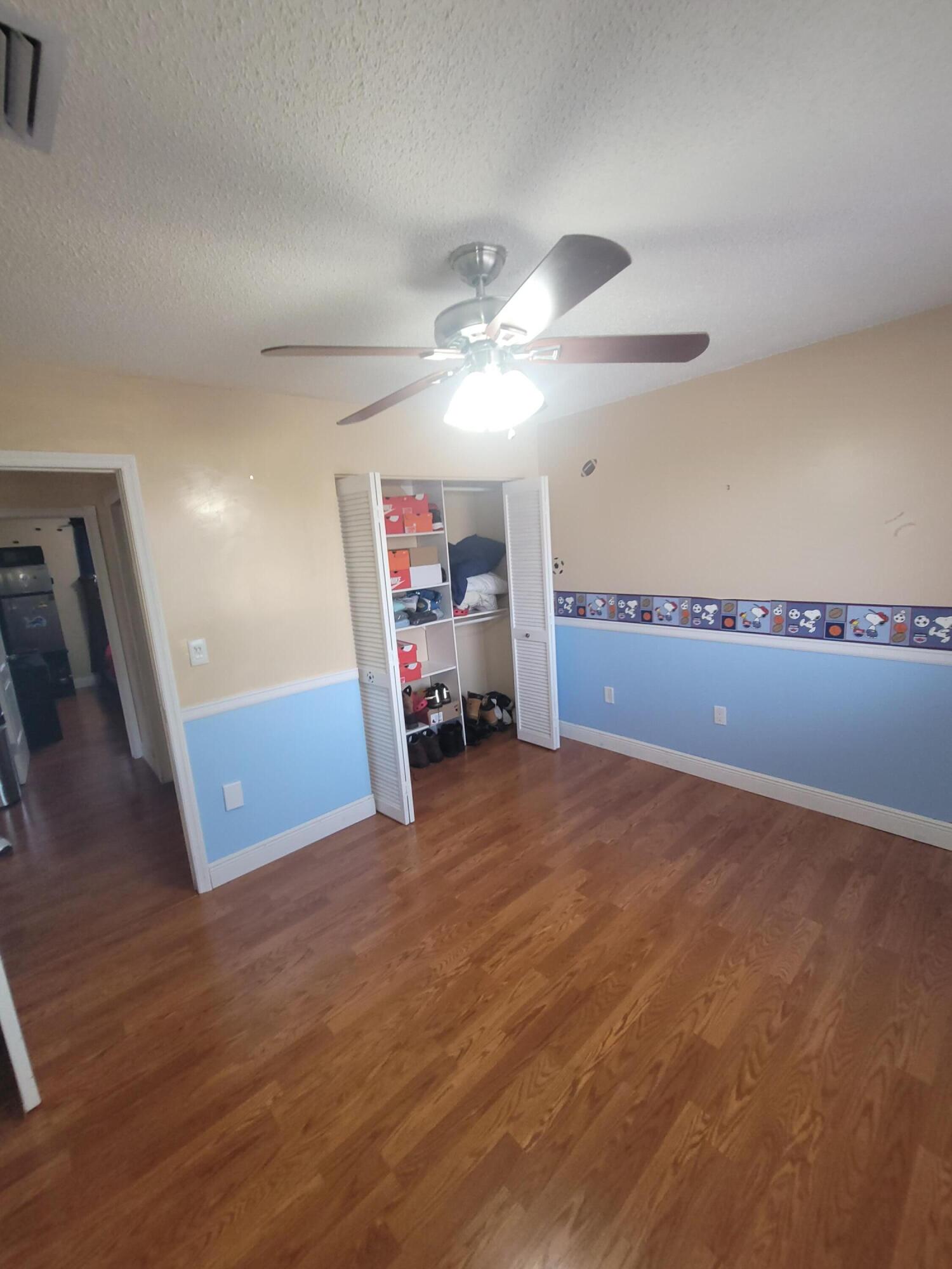 8448 Northwest 196th Terrace Hialeah, FL 33015 - Photo 23 of 67 a view of a livingroom with furniture and a ceiling fan