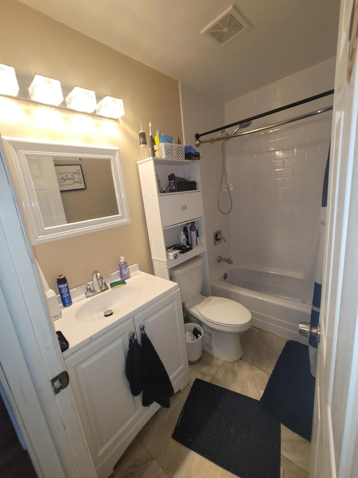 8448 Northwest 196th Terrace Hialeah, FL 33015 - Photo 25 of 67 a bathroom with a sink a toilet and shower