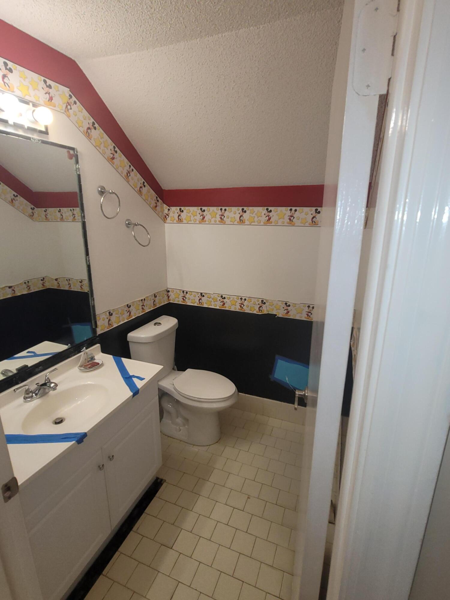 8448 Northwest 196th Terrace Hialeah, FL 33015 - Photo 26 of 67 a bathroom with a sink and a mirror