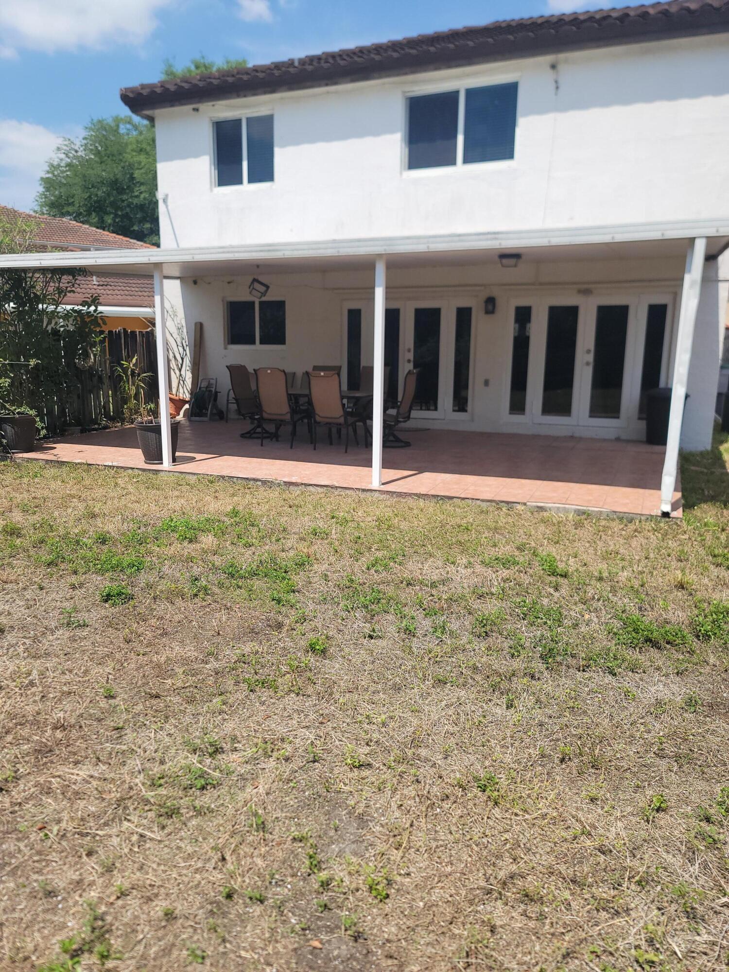 8448 Northwest 196th Terrace Hialeah, FL 33015 - Photo 32 of 67 a view of house with yard