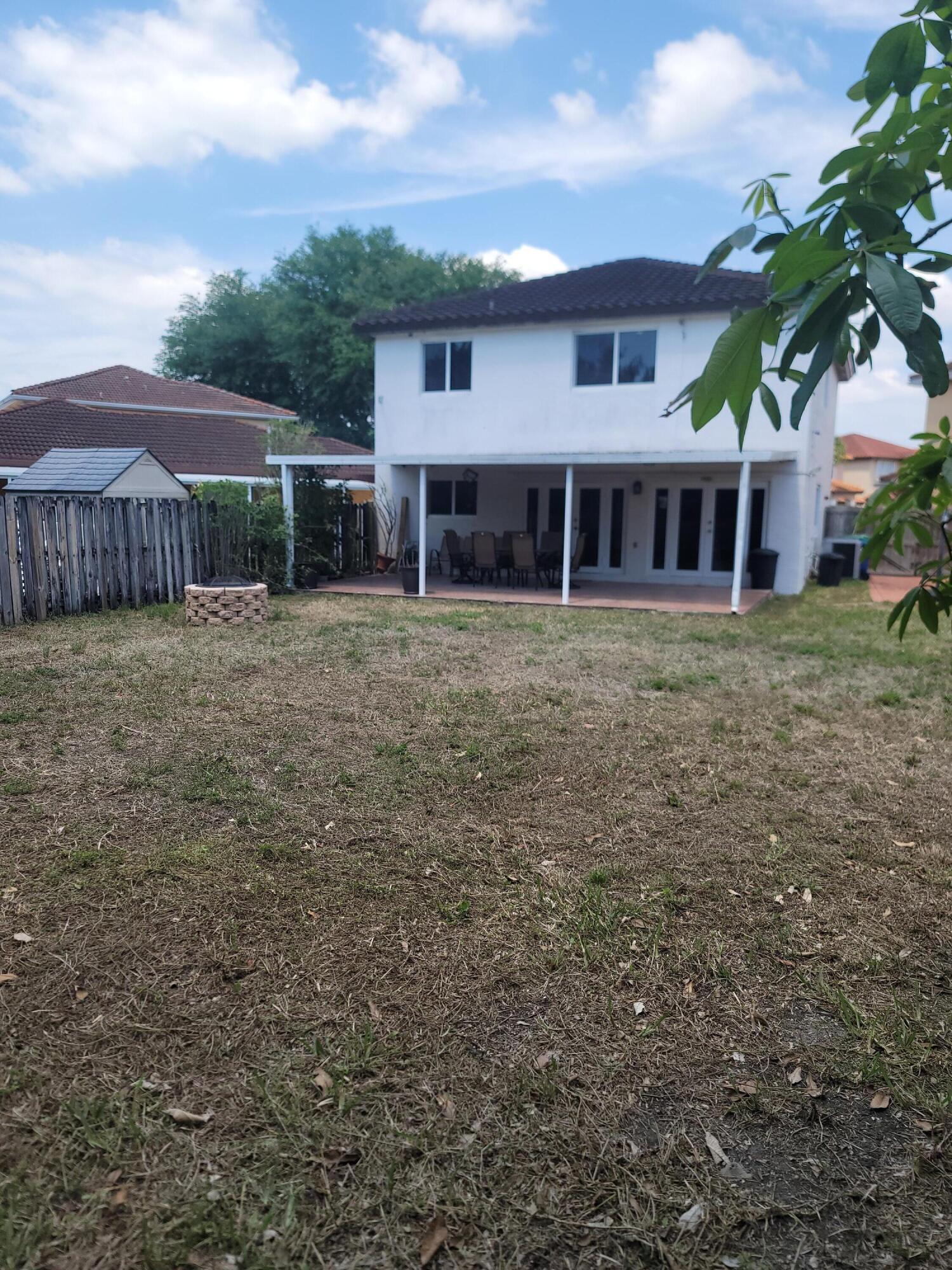 8448 Northwest 196th Terrace Hialeah, FL 33015 - Photo 37 of 67 a view of a house with a yard