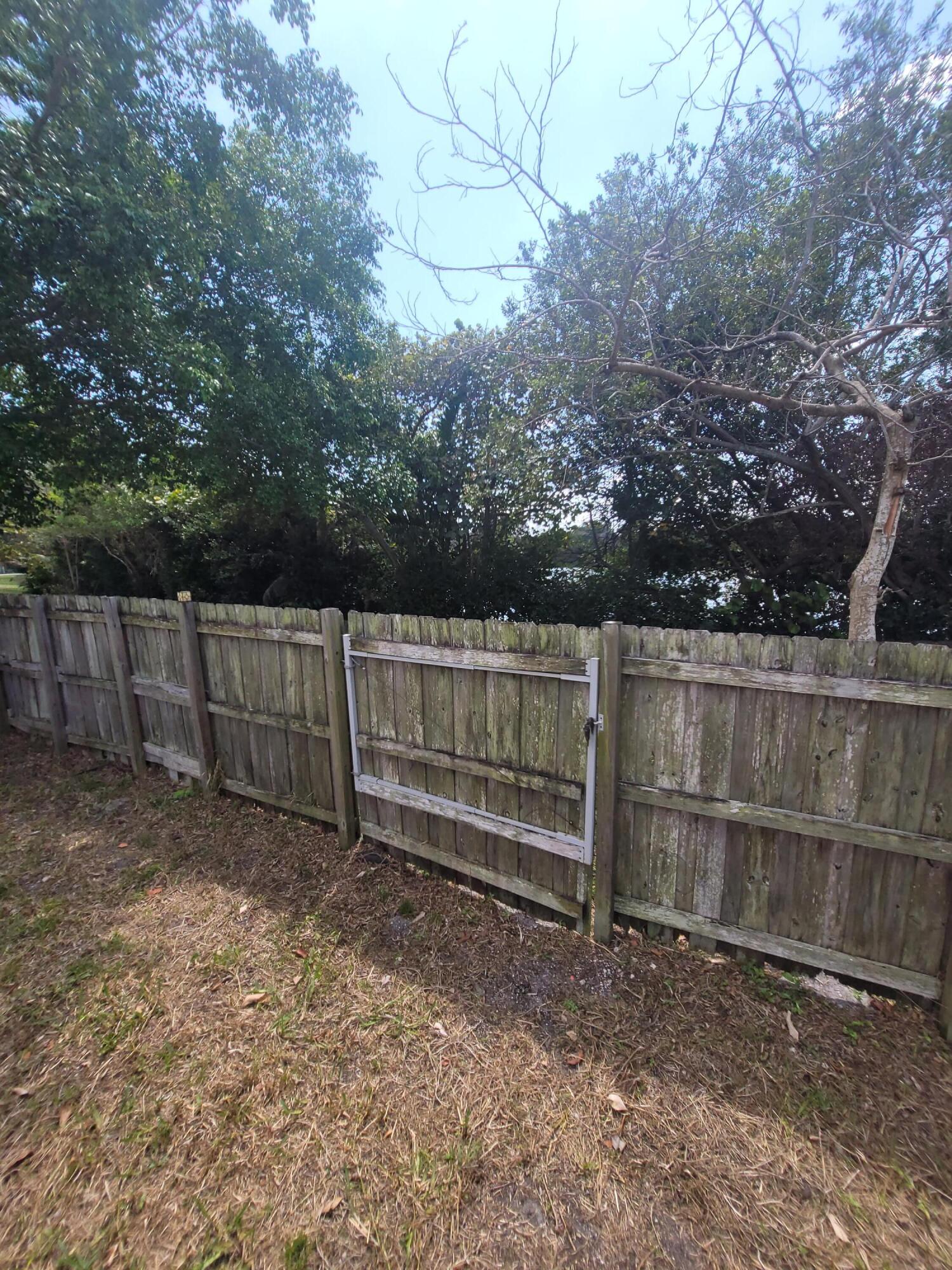 8448 Northwest 196th Terrace Hialeah, FL 33015 - Photo 43 of 67 a view of outdoor space with wooden fence