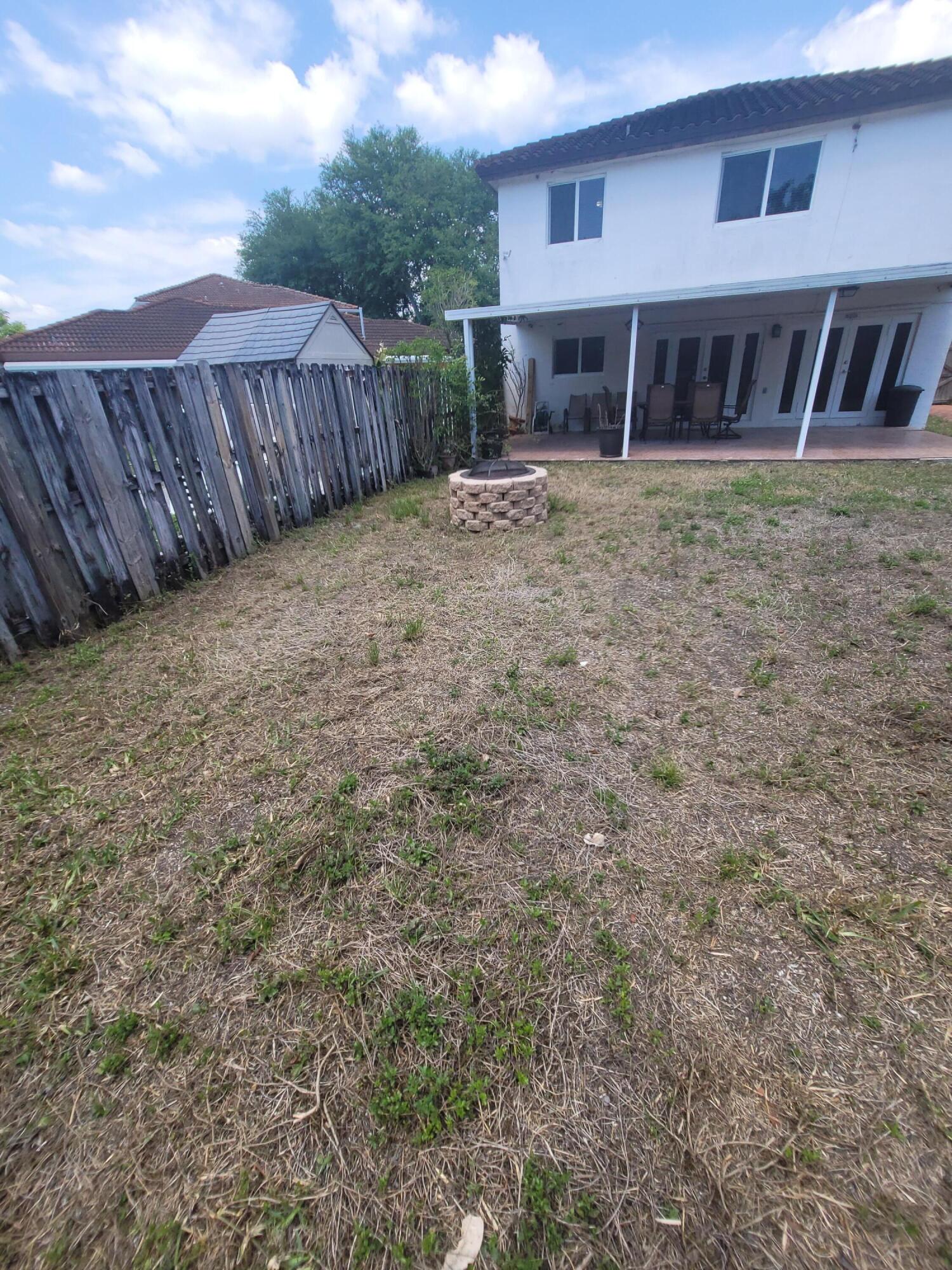 8448 Northwest 196th Terrace Hialeah, FL 33015 - Photo 49 of 67 a view of a house with wooden fence