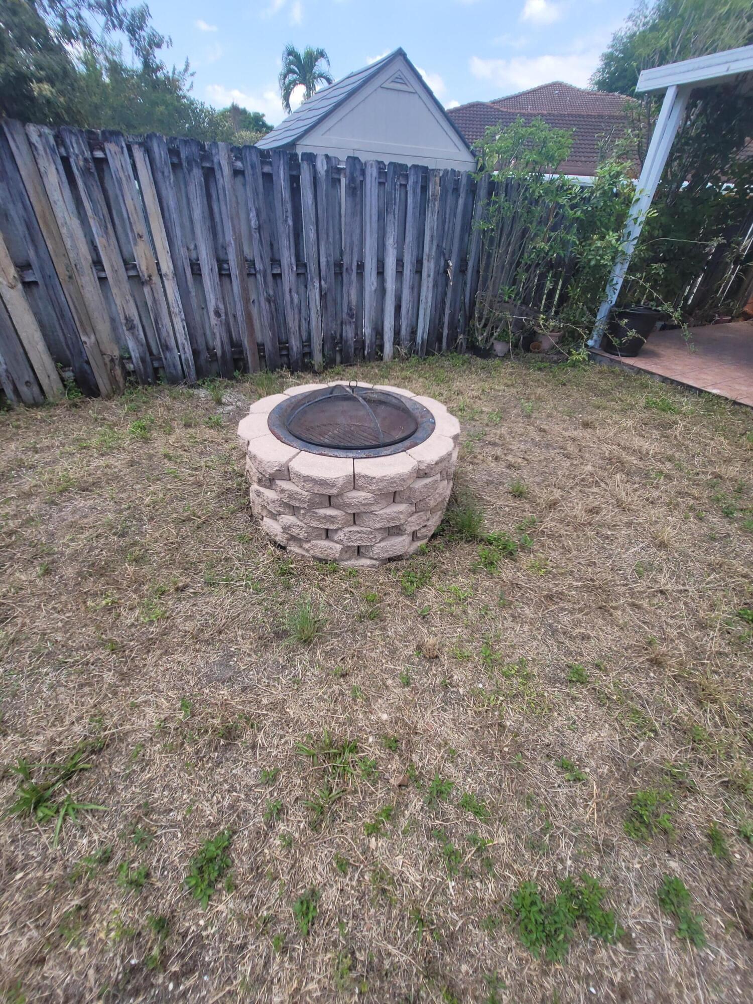 8448 Northwest 196th Terrace Hialeah, FL 33015 - Photo 50 of 67 a view of a backyard with wooden fence