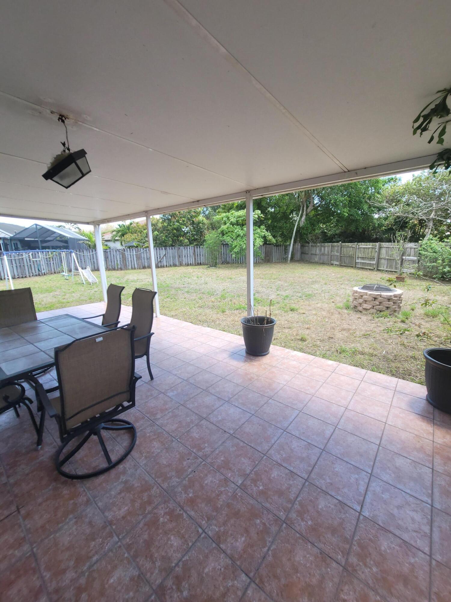 8448 Northwest 196th Terrace Hialeah, FL 33015 - Photo 53 of 67 a view of a patio with a backyard