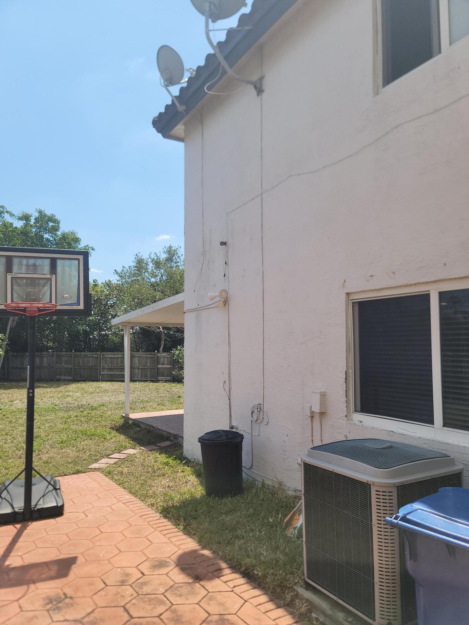 8448 Northwest 196th Terrace Hialeah, FL 33015 - Photo 59 of 67 a view of a backyard with a bath tub