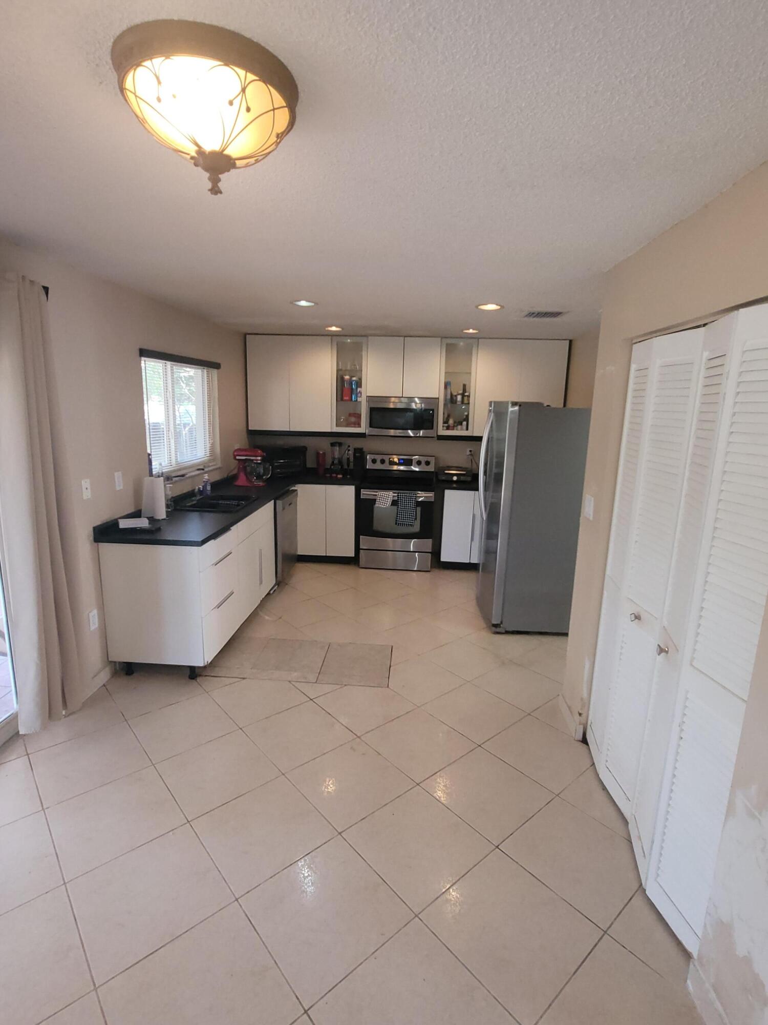 8448 Northwest 196th Terrace Hialeah, FL 33015 - Photo 8 of 67 a view of kitchen and window