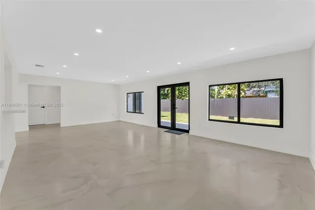 an empty room with windows