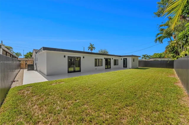 a view of a bathroom with a shower and a mirror