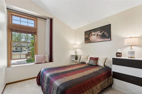 a bedroom with bed and window