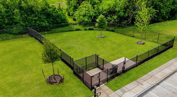 a view of a house with yard and sitting area