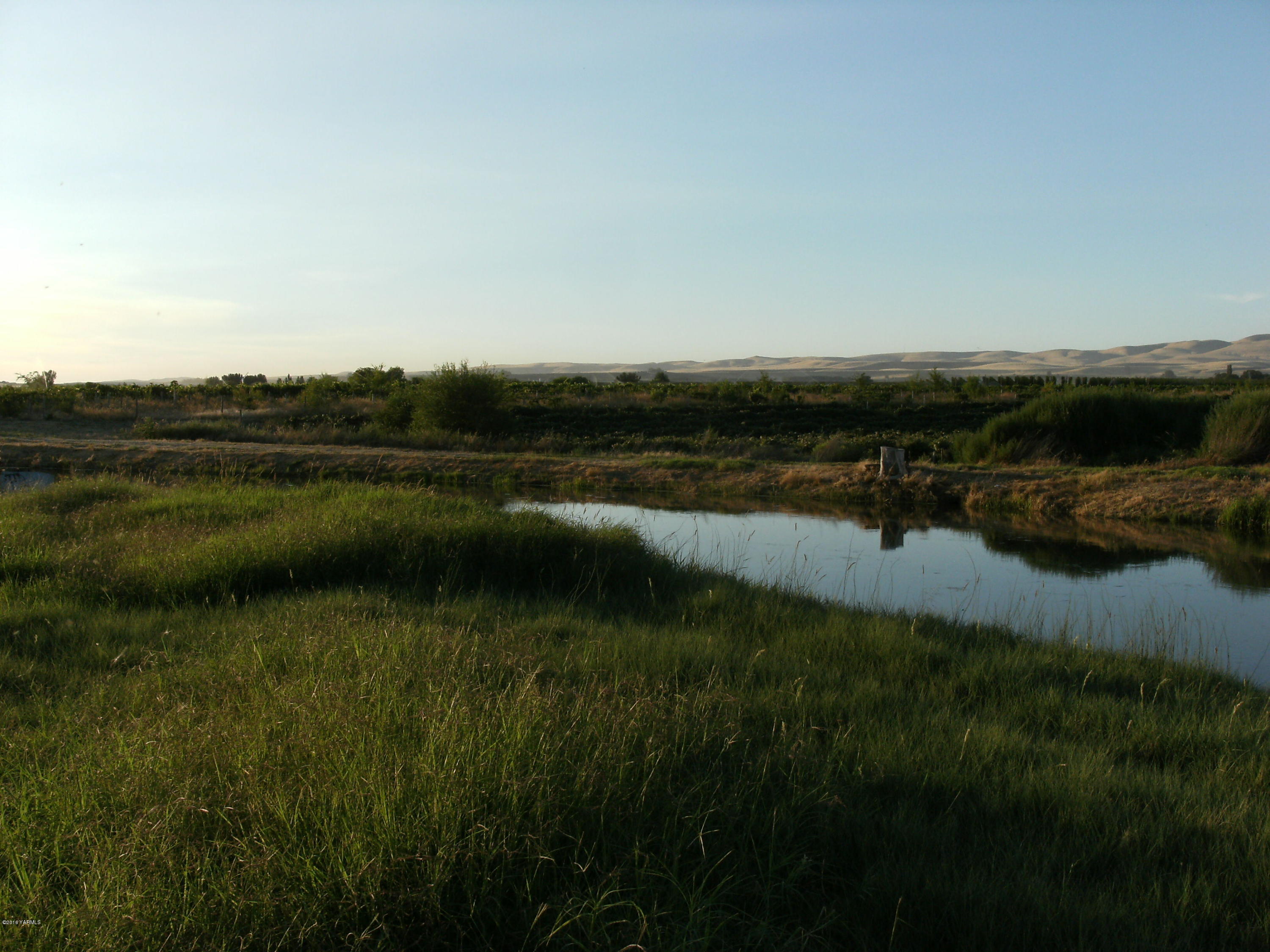 Nna Dekker Road Granger, WA 98932 - Photo 3 of 5 a view of a lake with houses in the back