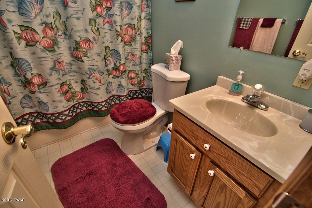 3296 Northgate Road Lake Ariel, PA 18436 - Photo 25 of 33 a bathroom with a sink and a mirror