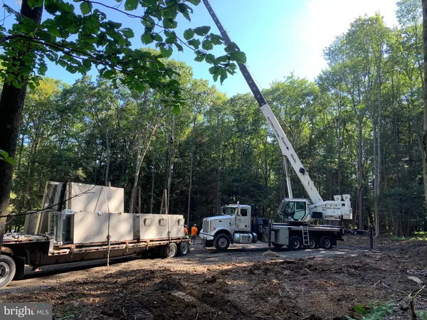 a view of a swimming pool with a yard