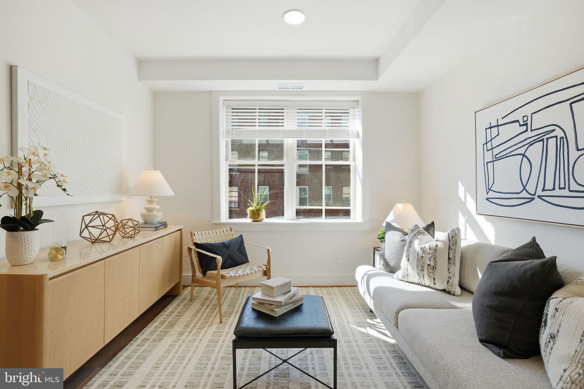 1451 Park Road Northwest, Unit 314 Washington, DC 20010 - Photo 12 of 22 a living room with furniture and a window