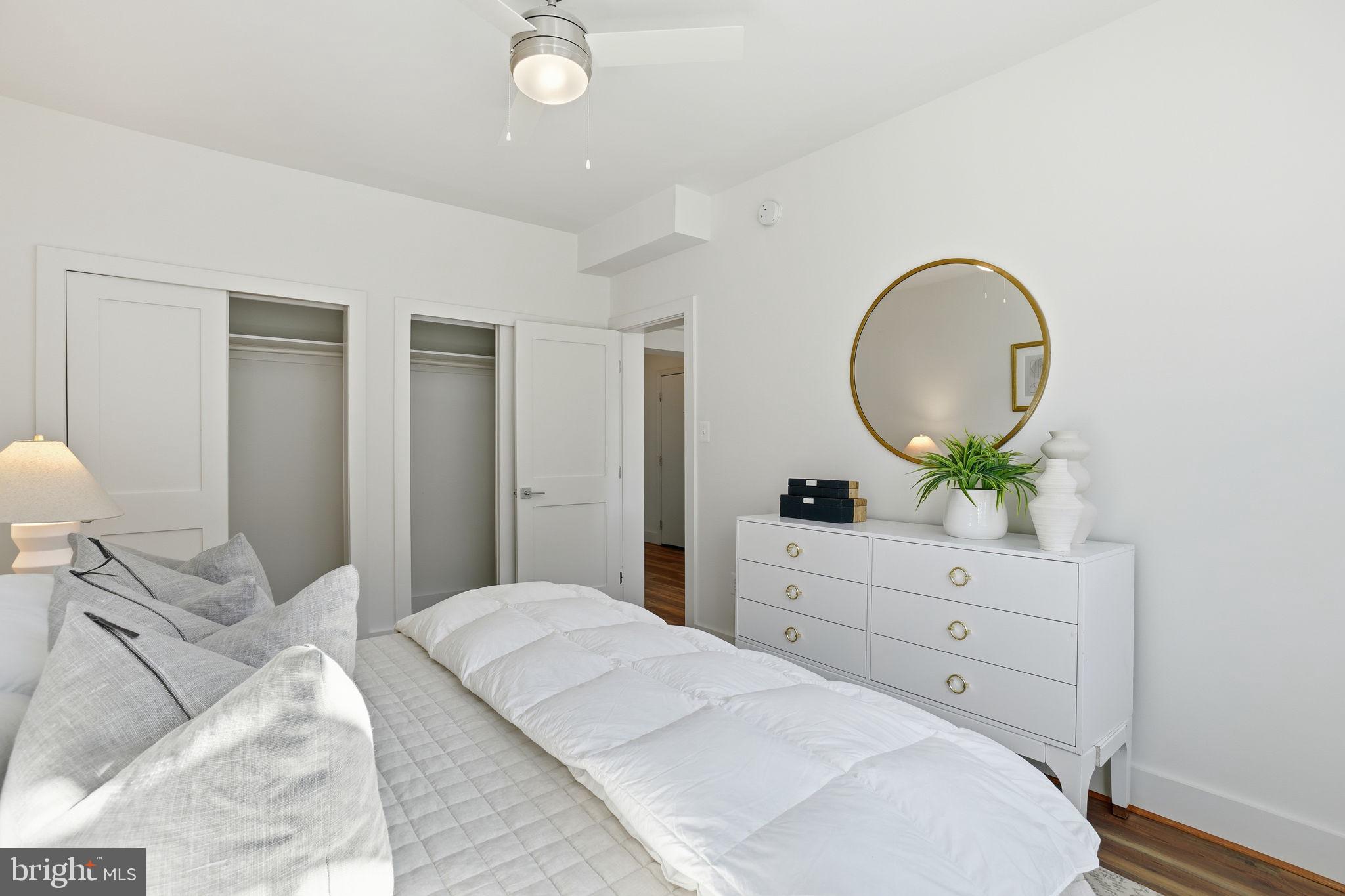 1451 Park Road Northwest, Unit 314 Washington, DC 20010 - Photo 18 of 22 a bedroom with a bed and a dresser