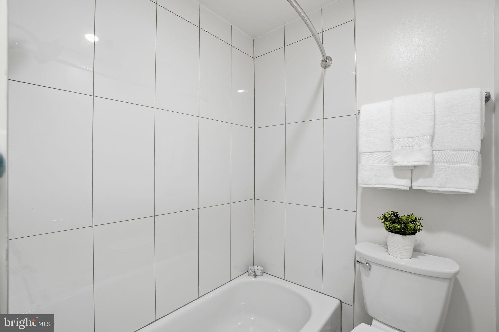 1451 Park Road Northwest, Unit 314 Washington, DC 20010 - Photo 20 of 22 a bathroom with a toilet and shower