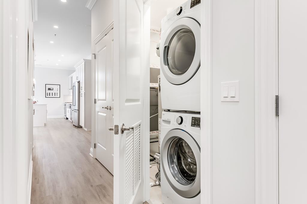 7652 Madison Street, Unit 304 Forest Park, IL 60130 - Photo 12 of 19 a view of a hallway with washer and dryer