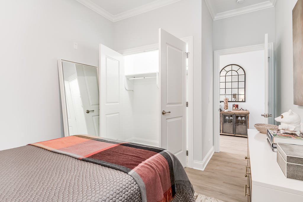 7652 Madison Street, Unit 304 Forest Park, IL 60130 - Photo 14 of 19 a bedroom with a bed and a dresser