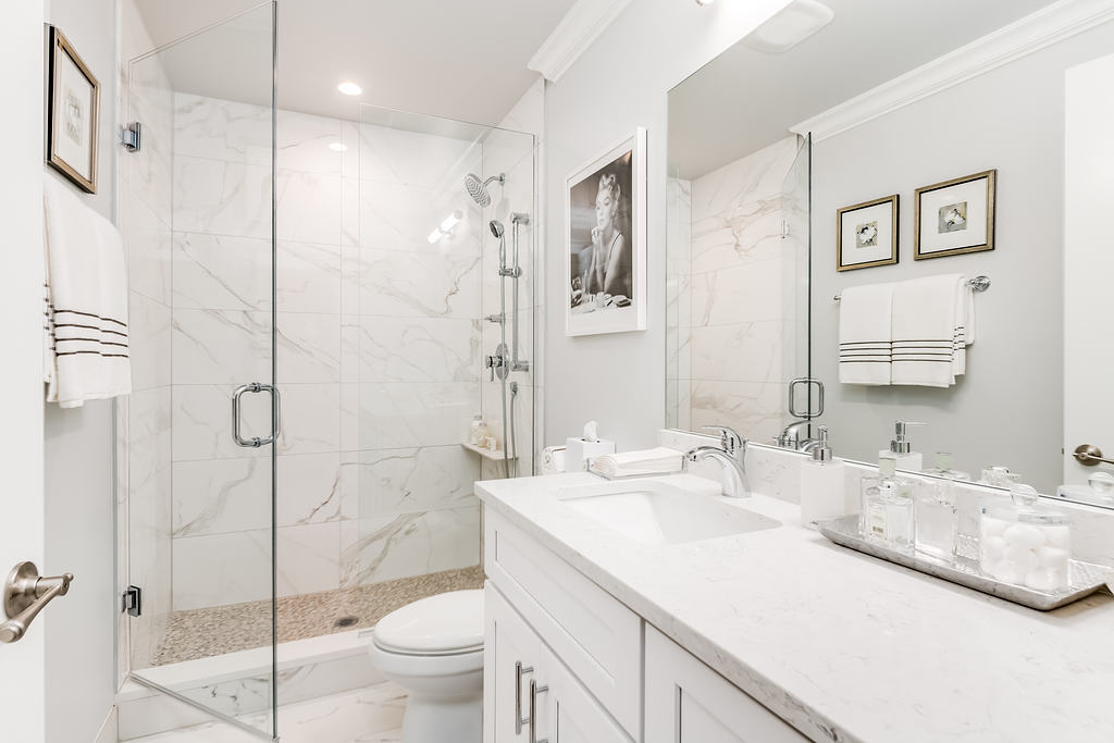 7652 Madison Street, Unit 304 Forest Park, IL 60130 - Photo 9 of 19 a bathroom with a granite countertop sink a toilet and shower